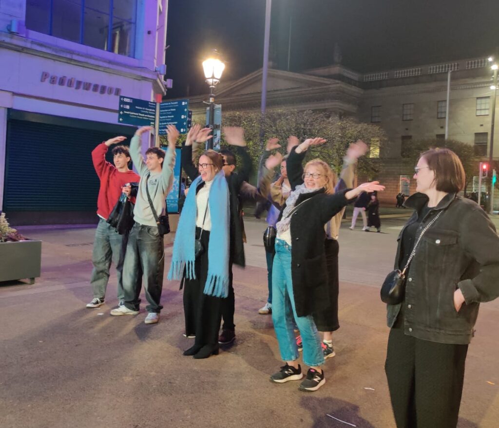 People waving hands, young people and adults